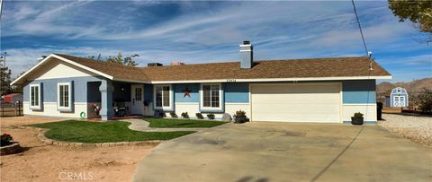 Photo of 22974 Standing Rock Rd, Apple Valley, CA 92307 (MLS # HD25266274)