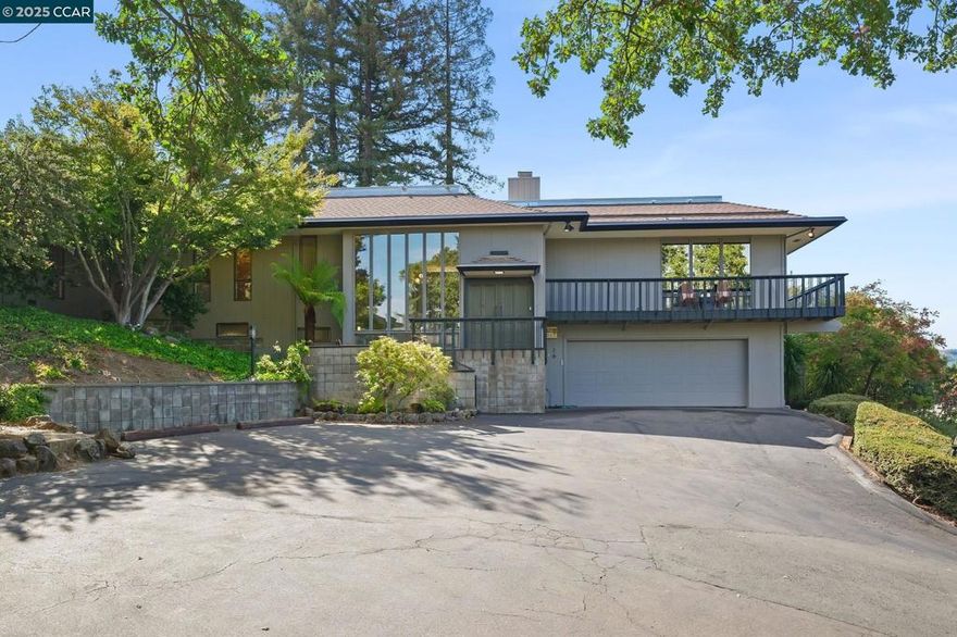 Mid-Century Gem brimming with character and timeless design, this classic mid-century home is set in one of Orinda’s most desirable locations near the Lafayette border. Expansive picture windows, a stone fireplace, and warm natural light define the formal living and dining rooms The open-concept kitchen with casual eat-in area connects seamlessly to a wonderful deck—perfect for entertaining or quiet retreat. The main level offers three spacious bedrooms, including an oversized primary suite with en-suite bath, plus an additional full bath, powder room, and large laundry. The lower level reflects the era’s signature versatility, featuring a second living space with fireplace, fourth bedroom, and flexible bonus room with storage—ideal for a home office, gym, or creative studio. Set on a lush lot with mature trees, the backyard is a private oasis with an inviting inground pool and classic California indoor-outdoor flow. Recent updates include fresh interior and exterior paint, new flooring and carpet, new hvac system and modernized lighting—all while preserving the home’s mid-century appeal. Enjoy nearby access to the Rim Trail at Lafayette Reservoir and close proximity to both downtown Lafayette and Orinda.