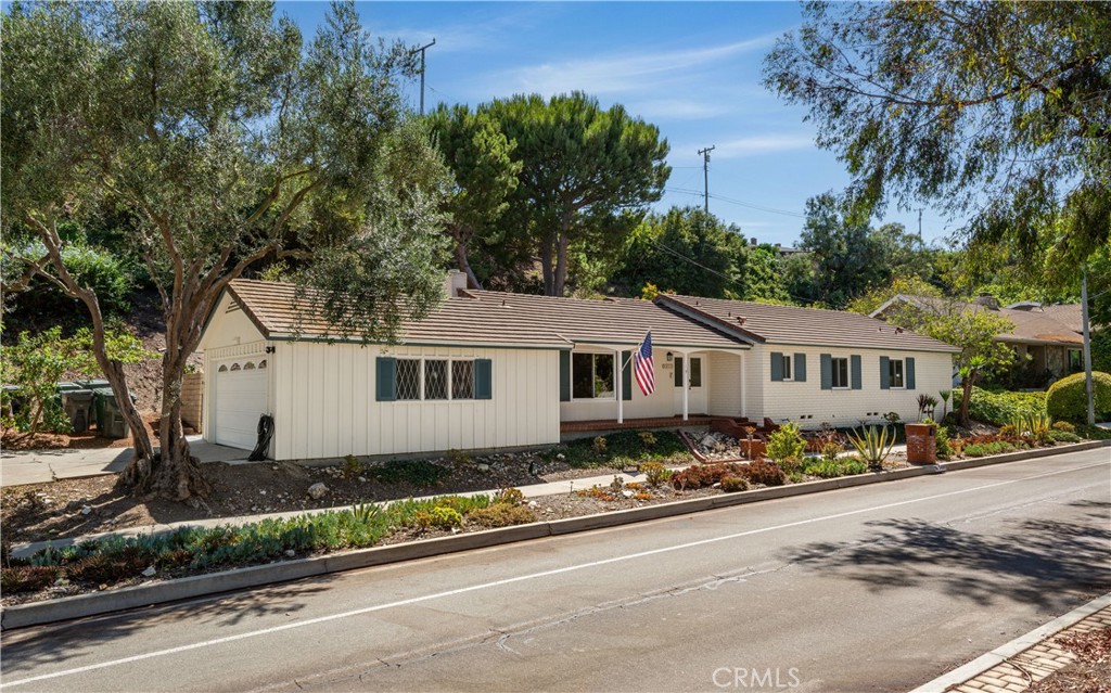 Welcome to this inviting 1,767 sq. ft. ranch-style home with 3 bedrooms and 2 baths. The bright living room with fireplace sets the tone for comfort, while the spacious family room off the kitchen features high beamed ceilings, creating the ideal gathering space. Step outside to the large patio, perfect for outdoor dining, entertaining, or simply enjoying the fresh air. This home offers a wonderful blend of charm, functionality, and easy single-level living.