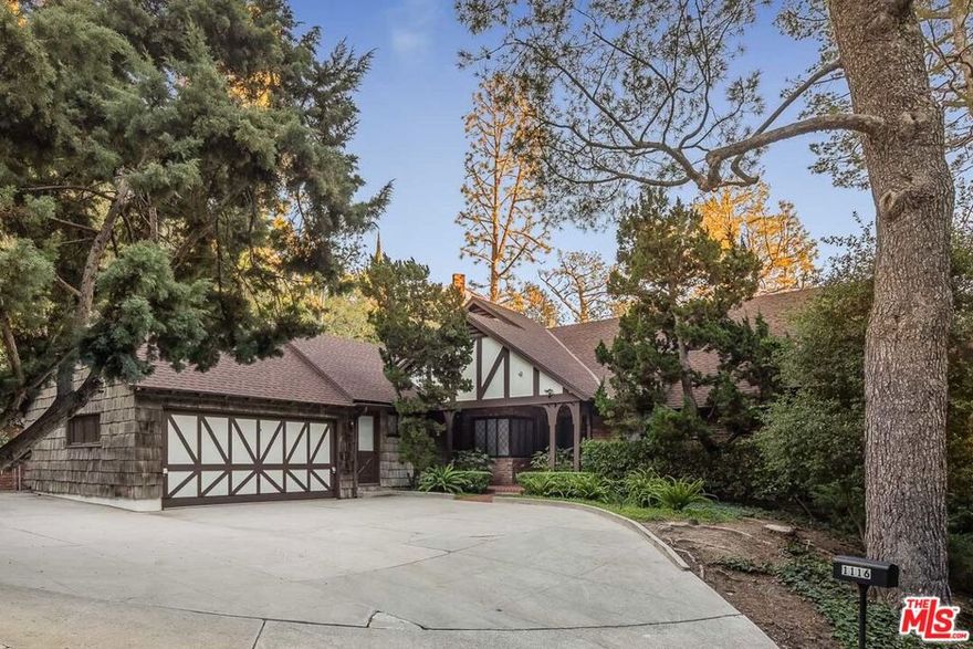 Charming Tudor in the best location in Beverly Hills. This view property sits on just over half an acre and is ready to be reimagined or developed into your dream home. Neighboring 1118 Calle Vista available as well to create a 1.5 acre compound in the estate section of Beverly Hills.