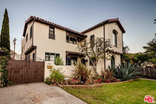 QUIET PRIVATE STREET(NO TRAFFIC AT ALL). LIVE IN ONE, RENT THE OTHER! Lower Unit will be Vacant! Gorgeous Spanish Revival Duplex in sought after Longwood Highlands! Proudly nestled on a beautiful tree-lined street of circa 1930's properties. Each unit boasts 3BR, 2BA & over 1,800 sq. ft. Looking for a Trophy Income Property, or a duplex that feels like a REMODELED HOME? Look no further! This one has it all, including the old world charm & character you covet. Seller meticulously restored and updated this home, drawing inspiration from all the original authentic details of its circa-1930's era build. The home includes Hardwood Floors + original beamed ceilings + wood casement windows and arches + Period wood doors & classic hardware + traditional courtyards/balconies. In addition, the property has remodeled kitchens w/ marble countertops & stainless steel appliances. Bathrooms are impeccable. Tankless Hot Water Heaters + Garage. Prime location near Wilshire+LaBrea. Near Everything!