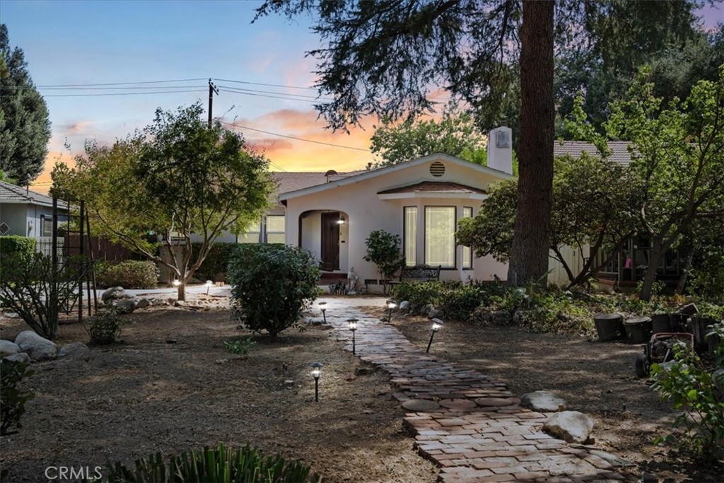 A beautifully maintained 1930s split-level home located in the desirable Shandin Hills neighborhood. Nestled on a quiet, tree-lined street with Little Mountain as its backdrop, this property offers a peaceful retreat just minutes from city amenities.Inside, you’ll find original hardwood floors in the living and dining areas, and an updated kitchen with granite countertops and tile flooring. Recent upgrades include a new roof, updated windows, new electrical panel, and new plumbing.The landscaped yard is drought-friendly with an automatic irrigation system, mature fruit trees, and a spacious raised wood deck—perfect for entertaining. A detached garage provides additional storage or potential ADU/casita opportunity.This home combines timeless character with modern updates and is ready for its next owner. Don’t miss this Shandin Hills gem!