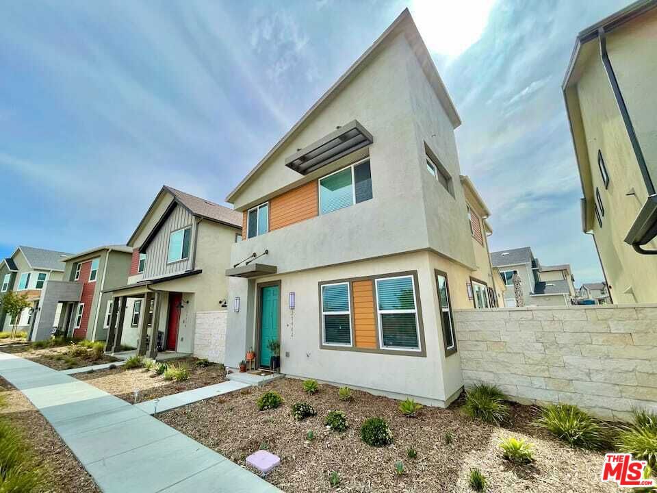 Nestled in the highly sought-after Clover community of FivePoint Valencia, 27482 Boulderview Way offers a rare blend of elevated upgrades, thoughtful design, and the privacy of a fully detached home. Inside, you'll find designer-selected finishes throughout, including premium soft-close cabinetry, luxury vinyl plank flooring, and custom tile in the bathrooms. The kitchen makes a bold statement with black marble inspired quartz countertops and premium appliances, blending style and functionality effortlessly. Additional highlights include epoxy-finished garage floors, a fully owned solar system, and an EV charger for modern, energy-efficient living. Step outside to a beautifully landscaped backyard complete with a fire pit and private hot tub, creating the perfect space to relax or entertain under the stars. Every detail was thoughtfully curated to elevate daily living and reflect the best of the modern California lifestyle.