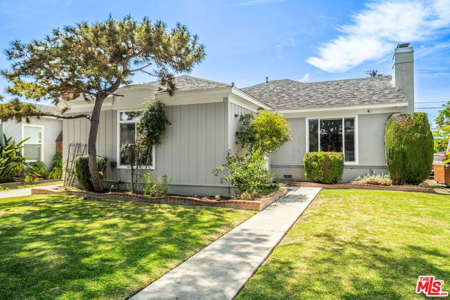 This spacious 3-bedroom, 2-full-bathroom home is set on a tree-lined street in an excellent central location. As you enter the residence, take in the expansive living room with a brick-surrounded fireplace and ample windows for natural light. Hardwood floors lead to the dining room, complete with a sliding glass door to the backyard and stylish light fixtures that pair nicely with the room's finishes. The space is open to the kitchen through the eat-in breakfast bar. The kitchen features plentiful cabinetry painted with Farrow and Ball designer paint in Sulking Room Pink, stainless steel appliances, an integrated dishwasher with a butcher block countertop, and a laundry area with a closet. The home offers three large bedrooms, including a primary with an upgraded en-suite and French doors to the backyard. Two guest bedrooms one with a walk-in closet are situated in a private nook off the living room. The updated full bathroom is outfitted with stunning terracotta tile, a double vanity, and a shower with vertically laid subway tile and a European-style glass shower door. Enjoy the stone patio in the backyard, which leads to a wooden deck overlooking the large koi pond and mature avocado tree, a serene escape from the city. The yard features manicured green space and inviting landscaping. A detached two-car garage is gated in the backyard with an EV charging port in the driveway. This desirable location is walking distance to the EXPO and LAX lines, blocks from West Adams and Crenshaw stores and restaurants, and close to multiple freeways. Call or text today to schedule a tour!