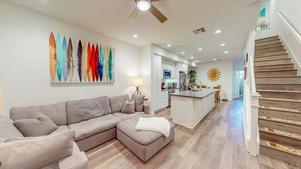 Amazing location and WEST of the 5!!! Very easy access to the beach, restaurants, parks, schools, library, pier, shopping, and all other local amenities. This coastal residence offers 1750 sq. ft. of thoughtfully designed living space across three floors. The home boasts 3 bedrooms and 3 bathrooms, providing ample space for comfortable living and entertaining. Optional 4th bedroom on ground floor is currently being used as a Flex-Space Office/Work Out area. The heart of the home is a sleek, modern kitchen featuring high-end appliances, ample counter space, and a large island perfect for casual dining or food preparation. Adjacent to the kitchen is a cozy dining area, seamlessly connecting to the living spaces. The primary bedroom, spanning 200 sq. ft., offers a retreat-like atmosphere with its spacious layout and en-suite bathroom. The additional bedrooms are well-appointed, each with its own unique charm. Throughout the home, you'll find a harmonious blend of functionality and style. The living areas are bright and airy, with carefully curated decor that reflects a coastal aesthetic. Hardwood floors run throughout, adding warmth and continuity to the space. The bathrooms are modern and well-equipped, with one featuring a glass-enclosed shower adorned with lush plants, creating a spa-like atmosphere. A dedicated laundry room adds convenience to daily life. Additional features include a home office space, ample storage solutions, and an attached two car garage. The property's layout, with its multiple levels and well-defined spaces, offers both privacy and areas for gathering, making it an ideal home for modern living in the heart of Oceanside.