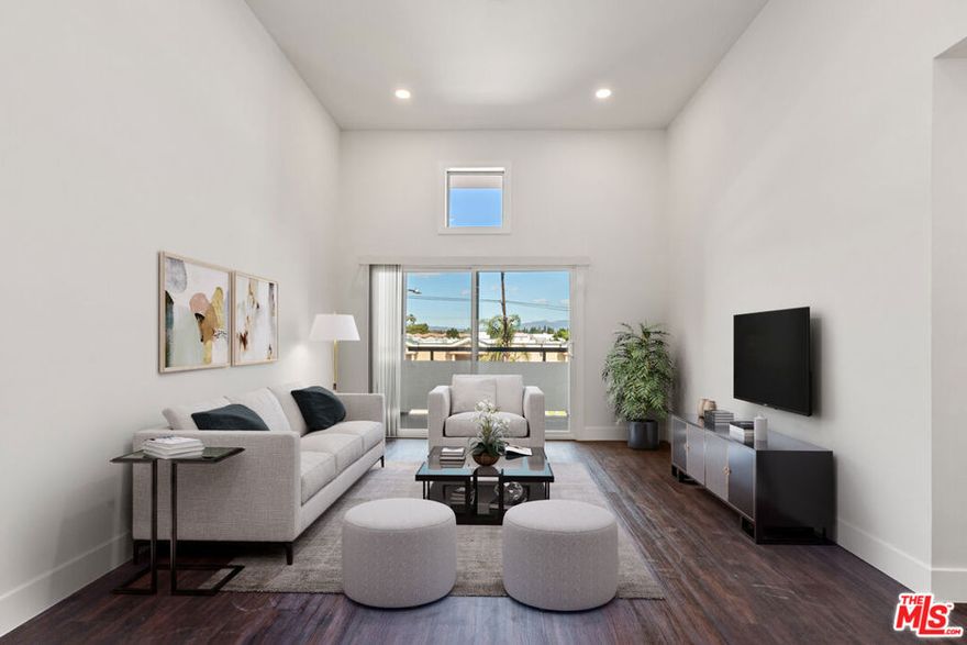 Immerse yourself in luxury in this chicly remodeled 1 bed, 1 bath, top floor unit, boasting a stylish kitchen, bathroom, stainless steel appliances, Nest thermostat, laminate wood flooring, and LG washer/dryer. Bask in the natural light of the open floor plan with high ceilings and private balcony. A stone's throw away from the Sepulveda Basin wildlife reserve, local eateries, and the convenience of the 405 and 101 freeways. With central AC, updated appliances and recessed lighting throughout, this unit offers modern living at its finest. The updated bathroom has an LED mirror, built-in Bluetooth speaker and sliding glass shower doors showcasing the updated hardware and shower head. In the bedroom one will find custom closets, contemporary recessed lighting and additional storage above the bed. Fall in love with this serene Lake Balboa building complete with updated parking (Now with EV chargers available!), a sparkling plunge pool and a welcoming lobby. You'll definitely want to call this home.