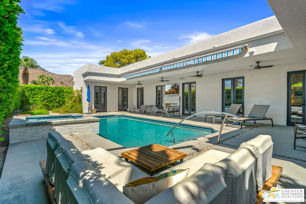 Reminiscent of a European villa/estate with a contemporary vibe, this thoughtful 100% renovation exceeds expectations & exudes sophistication & panache. Voluminous spaces, stellar continuity and handsome appointments. This walled and gated estate offers numerous exterior entertaining spaces with a firepit and a poolside fireplace. The great room offers stunning built-ins & wonderful fireplace. The incredible chef's kitchen is fully outfitted with Thermador appliances including a steam oven, top of the line induction cooktop, 2 dishwashers, custom cabinetry, gorgeous quartz countertops and exquisite fixtures. Formal dining room offers a custom 14' bar with wine cooler, beverage fridge and ice maker. The lavish Primary suite rivals the finest of 5-star hotels with its own fireplace, patio access and oversized spa like bath complete with heated flooring. Oversized laundry and pantry. Special updates include 13 sets of new custom manufactured Anderson French doors, owned solar with 2-13kwk back up batteries, California Closets, integrated Sonos system and a fantastic outdoor kitchen featuring a Hestan grill, Evo cast iron griddle and prep sink. The updated pool and spa include a new hybrid elec/gas heater. Truly a one-of-a-kind property not to be missed.