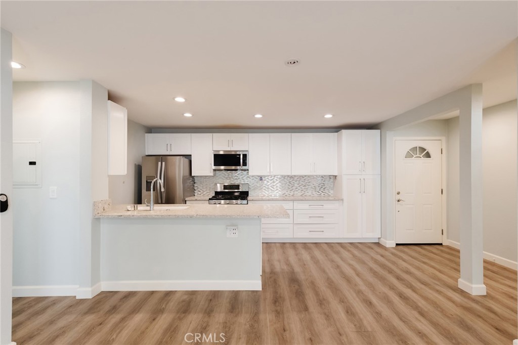 Discover modern elegance in this beautifully updated 2-bed, 2-bath condo, tucked away in a lushly landscaped building. The open floor plan seamlessly connects the living spaces, while the kitchen, equipped with sleek stainless steel appliances, adds a touch of sophistication. Step out from the living room onto your private balcony, basking in the abundance of natural light that fills the space. Indulge in resort-style living with access to the building's pool, sun deck, and community room, perfect for relaxation and entertainment. Situated in the prime South Bay area, this condo offers easy access to major freeways, a variety of local eateries, breweries, and is just a short drive away from the serene beachfront. Embrace the South Bay lifestyle in this remarkable condo - your oasis in the heart of convenience and comfort.