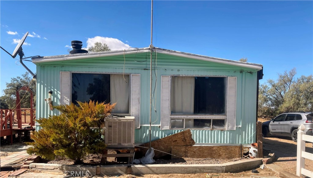 Discover a rare and versatile property with three detached manufactured homes set on 40 acres of land in San Bernardino County. This one-of-a-kind parcel offers exceptional potential for business, farming, rental income, or creating your own private estate.
The land features two dry fishing ponds, a newly installed well water pump with raised concrete foundation (approved to county standards), and valuable water rights—a true advantage for future development or agricultural use.
Home 1: 1,344 sq. ft. with a private dock overlooking one of the ponds.
Home 2: 1,152 sq. ft.
Home 3: 840 sq. ft.
Previously operated as a fee-fishing business, the property already has a history of generating both business and rental income. The secluded setting offers privacy and tranquility, while still providing approximately 1,320 feet of frontage on Valley Center Road with matching depth.
Neighboring properties thrive with crops such as pistachios and alfalfa, highlighting the agricultural potential. While the homes need some repairs, the foundation is here for a truly special investment—whether you envision farming, recreation, business, or a private retreat.
this is a hidden gem with limitless possibilities—don’t miss your chance to own a piece of land with water rights, income potential, and wide-open space to make your vision a reality.
Whether you are looking to create a farming operation, reestablish a fishing business, generate rental income, or design a private retreat, this property delivers the space, water rights, and potential to bring your vision to life. Rarely does a property combine this much acreage, income history, and development flexibility in such a private and peaceful setting. Don’t miss the chance to turn this hidden gem into your next great investment.