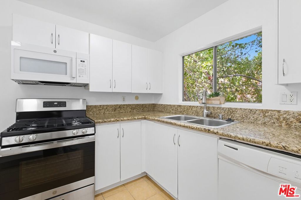 Discover this rare 3-bedroom, 2-bathroom condo offering 1,030 sq ft of bright, functional living space in the heart of Tarzana. Located on the second floor, this home features a spacious living room that flows to a private balcony, a primary suite with en-suite bath, and two additional bedrooms for family, guests, or a home office. Laundry hooks are in the unit! 2 parking tandem spaces are assigned. The gated Tara Village community is a hidden gem with resort-style amenities: sparkling pool and spa, fitness center, clubhouse, BBQ/picnic areas, playground, community laundry, and beautifully landscaped grounds. HOA dues include water, gas, trash, and sewer, adding extra value and peace of mind.Perfect for first-time buyers or anyone starting their real estate journey, this condo combines affordability, comfort, and convenience. Just minutes from Ventura Blvd, 101 & 405 freeways, shopping, dining, Trader Joe's, and schools, this is one of the most affordable opportunities to own 3 br in Tarzana. Resort-style amenities: pool, spa, gym, playground & more. HOA covers gas, water, trash & sewer. Prime Tarzana location near shops, restaurants & freeways. Schedule your tour today!