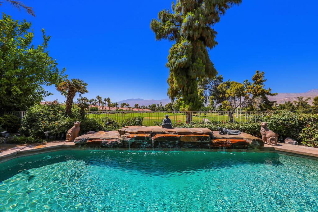 Welcome to sought-after Rancho Mirage Country Club. This rare, freestanding two-story home is one of only eight of this larger model ever built in Ranch Country Club, and none compare to this one. Perfectly positioned on a premium interior lot, it boasts sweeping 180 degree south and west-facing views overlooking four fairways, sparkling lakes, and the majestic mountains beyond.Designed for those who appreciate quality and space, this home offers 4 bedrooms, plus a large office with beautiful pocket doors, and 4 bathrooms.The residence is loaded with top-tier upgrades and custom features throughout. With dual master suites, one on each level, it's ideal for flexible living or hosting guests. The upstairs suite features a private loft retreat, while the downstairs suite offers a serene spa-like escape.The heart of the home is the gourmet kitchen, crafted for the serious chef. Highlights include a Thermador professional gas/electric range, 42'' Sub-Zero refrigerator, Bosch dishwasher, double GE Monogram ovens, and a custom wine chiller. Rich Alder cabinetry with sleek nickel hardware pairs perfectly with single-slab granite counters and a tumbled travertine backsplash, all in warm, inviting tones. An oversized island provides ample prep space and casual seating.Soaring 20-foot ceilings in the living room elevate the open-concept design, while custom built-ins throughout the home add both function and sophistication. High-end tumbled travertine flooring runs seamlessly throughout.Step outside to a backyard oasis where multiple seating areas, a built-in BBQ, and a private spa await, all surrounded by jaw-dropping views that redefine ''premium.'' This is desert living at its finest.Don't miss this extraordinary opportunity to live in one of the rarest and most desirable homes in the community.HOA fees include; roof, exterior paint, stucco, skylights, cable, TV, high-speed Internet, guard gate, front, landscape, maintenance, for community pools, and spas, maintenance of golf course, green space, and common areas.This home is available for either seasonal at $9,500 or long term at a lower monthly rate. Pets ok with at $500 deposit per pet