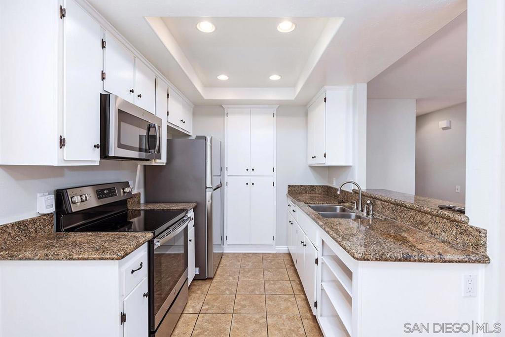 Private end-unit 3 bedroom condo on second floor with large balcony, perfect for entertaining or grilling on the weekends! This home features hard floors throughout, custom window trims and updated kitchen with granite counter tops and updated lighting. Master bedroom spacious walk-in closet and large bathroom vanity. Home sits above of its 2 car garage with no neighbors below! One additional parking space can be purchased through HOA. Large laundry room with side-by-side washer and dryer. This is a well manicured complex and community pool. HOA pays water, sewer, and trash. Equipment: Dryer,Garage Door Opener, Washer Sewer: Sewer Connected Topography: LL