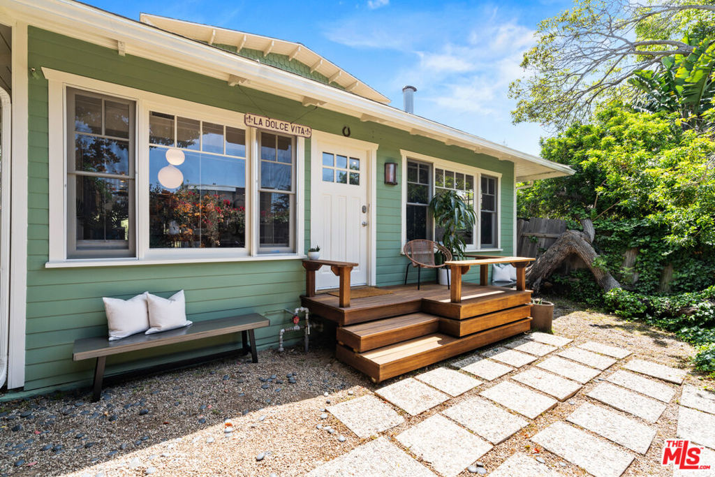 Central to everything, this quintessential Venice bungalow is move-in ready with plenty of space. Just seconds from Rose Avenue, blocks from Abbot Kinney, and a short stroll to the beach, it's the ideal blend of location and lifestyle. Pass through the ivy-lined gate and discover a back yard designed for gathering. Inside, light-filled open spaces create a welcoming atmosphere, highlighted by two fireplaces, a loft, and easy flow to outdoor decks. Golden hour here is uniquely magical, with sunlight streaming through and framing the connection to the outdoors. The lush backyard is perfect for alfresco dining, nights around the fire pit, or simply soaking in the ocean air. Walking distance to Rose Ave, where you will find Cafe Gratitude, American Beauty, Moon Juice, Venice Beach Wine Bar, Chulita and Wabi Sabi and also close to shops and walking distance to the beach! This home captures the casual charm and energy of beachside living.