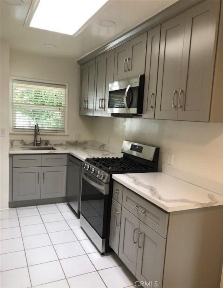 New updated 1 bedroom 1 bathroom apartment features an updated kitchen and full bathroom. The apartment features stainless steel kitchen appliances including the refrigerator, dishwasher, microwave and stove/oven. The living area and bedroom have light hardwood floors and the apartment also features large bay windows throughout bright living and dining areas. The unit comes with a garage space with ample storage space in a shared garage with wireless remote and keypad entry.
The property features its own private well maintained community coined laundry room. The private grassy courtyard area is quiet and perfect for gardening or relaxing in the sun. This well maintained complex is just a short walk to the beach, shops and restaurants.