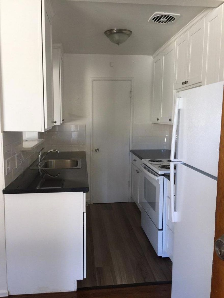 Fantastic location! Close to shopping, dining, and  transportation. Six one bedroom apartments, two on the first floor and four on the second floor.   Four garages and two covered parking spaces. One unit has just vacated and is available for rent.