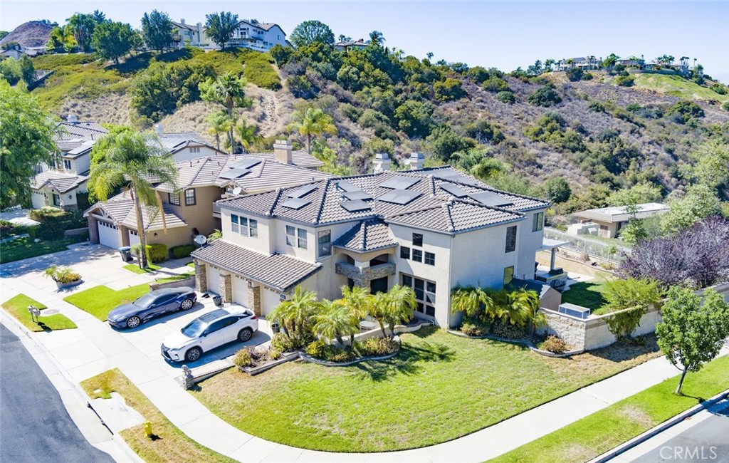 Welcome to Sierra Del Oro! Live in one of the best non-HOA communities of Corona. This huge 5Beds/3Baths 3 cars garage house up in the hills have amazing views of the surrounding mountains and cityscape during the day and magical city lights at night. Conveniently situated off of Green River, provide convenience access to Orange County on the 91 while providing access to the greater Inland Empire by the 91/15 freeways. Double iron door entry opens up to high ceilings in a spacious environment to which you can enjoy all that this spacious house has to offer. 4 bedrooms are upstairs while there is one bedroom downstairs for guests or elderly who cannot use the stairs. Soak in the sunlight and beautiful views from the many windows in this home today!