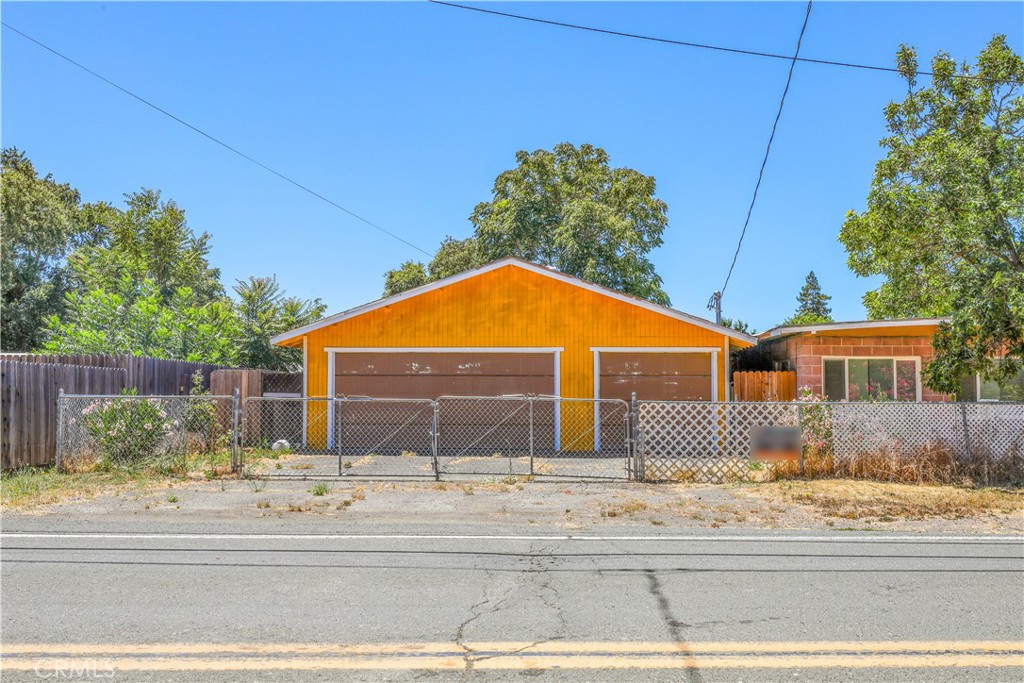 Great income potential with this property featuring 3 separate units. Live in one and rent the others: Unit 1 is a double-wide manufactured home on a 433 foundation with 2 bedrooms, 2 bathrooms, a carport, and new mini ductless units; Unit 2 is a brick studio with a kitchen and bathroom; Unit 3 offers a full kitchen, bath, bedroom, and a 3-car garage. The property has ample parking, a private yard with a shed, and all units are on separate electric meters with newer roofs. It includes two parcels: 6309 5th Ave (APN: 034-113-200-000) and 6299 5th Ave (APN: 034-113-190-000). Square footage includes all units combined; buyer to verify.
