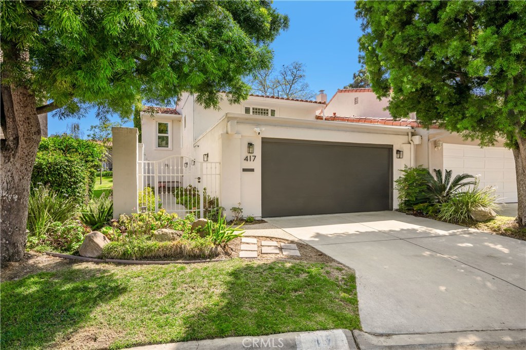 This rarely available and highly desirable Z-Plan is the largest model in the community at 2,642 square feet. Unlike most attached homes, this residence offers exceptional privacy, its only shared wall is at the garage, with no interior walls connected to the neighbor. Nestled in the sought-after North Bluff’s neighborhood, this 4-bedroom, 3.5-bathroom home offers a seamless connection between indoor and outdoor living with a spacious wraparound patio and refined interior updates throughout.
The main level is filled with natural light, custom travertine flooring, recessed lighting, and an open-concept layout ideal for entertaining. The living room features a striking marble fireplace, custom built-in shelving with soft-touch closures, and dual sets of French doors leading to the expansive backyard patio.
The remodeled kitchen is a chef’s dream with premium quartzite countertops and backsplash, white cabinetry with updated hardware and hidden appliance garage, a beautiful center island with plenty of storage space, and premium appliances. Custom window treatments, including automatic shades and drapery, add both style and convenience.
Upstairs, the luxurious primary suite features, a sitting area, separate his-and-hers spa-inspired bathrooms with walk-in California Closets, and a travertine walk-in shower, and a jacuzzi tub. Premium upgrades include new vanities, mirrors, Toto smart toilets, and hand-applied Roman Clay wall treatments (Portola Paints). Two additional bedrooms, a remodeled full bath, custom closet doors, Newly installed wide-plank wood flooring enhances the entire upper level and lower level bedroom. On the main floor, the fourth bedroom is currently used as a media room/office, complete with custom built-ins, and an en-suite bath.
Additional upgrades include custom iron stair railings, luxury light fixtures throughout, updated landscaping with jasmine and dwarf olive trees, a tesla charger in garage and a standalone wooden heat sauna on back patio for the ultimate relaxation retreat.
Community amenities include a resort-style pool, playground, and walking paths surrounded by tranquil greenbelts. Walking distance to Ralphs plaza, and close to the Newport Beach Tennis Club, Back Bay hiking trails, and easy access to Fashion Island, Balboa Island, and John Wayne Airport. Located in a top-rated school district, this turn-key home checks every box for luxury living in a prime Newport Beach location.