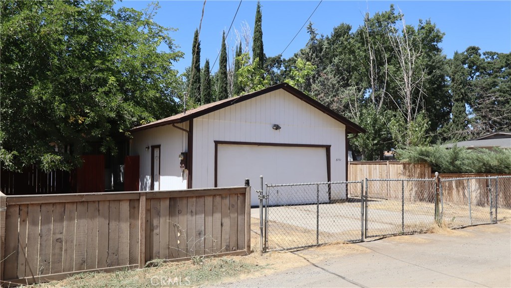 Comfortable, Convenient, and Close to the Lake! This move in ready, beautifully maintained two bedroom, two bath home offers an open floor plan, an upgraded kitchen filled with natural light, and sliding glass doors that lead to a peaceful outdoor seating area. Situated on a large, fully fenced lot with level ground, there’s plenty of room for parking, gardening, or just enjoying the space. The over sized two-car garage provides direct access into the home and includes extra room for a workshop or storage. A separate storage building adds even more flexibility. Located just five minutes from the lake for boating and recreation, and close to public transportation and everyday amenities, this property is ideal as a primary home, vacation retreat, or investment opportunity. Enjoy the ease of small-town living with big outdoor perks—just two hours from the Bay Area or Sacramento.