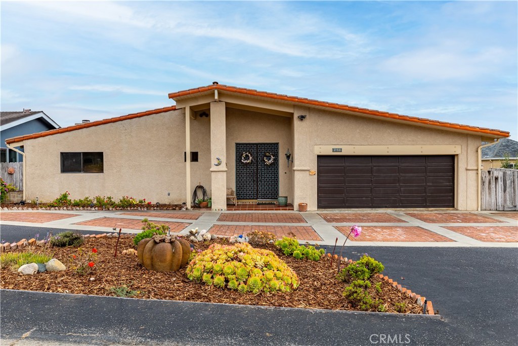NEW PRICE! - Welcome to 750 Luisita Street – A Rare Ocean-View Gem in Morro Heights - If you've been dreaming of ocean views,the soothing sound of waves, and ample space for the whole family,your search ends here. Nestled in the highly sought-after Morro Heights neighborhood of Morro Bay, this move-in ready, single level living, extraordinary home sits on one of the largest lots in the area,offering 4,043 sq ft of well-designed living space. From the moment you step inside,you'll be welcomed by vaulted ceilings,a bright,open floor plan,and abundant natural light streaming through oversized windows. Large wood doors lead into the foyer and the spacious living room,where picture windows and sliding glass doors frame stunning south bay and ocean views. The well-appointed kitchen includes plenty of counter space and lovely wood cabinetry,an eat-in breakfast bar,and a charming peek of Morro Rock from the kitchen sink. The kitchen flows effortlessly into the generously sized dining area, perfect for entertaining. Open the sliding door to the deck and enjoy ocean breezes while dining al fresco or relaxing with guests. Wake up to south bay and surf views in the private primary suite, complete with direct deck access. The luxurious en-suite bathroom includes a dual-sink vanity,soaking tub,walk-in shower,and walk-in closet. Down the hall, you’ll find a cozy den or office/bedroom with its own fireplace—an ideal retreat for reading or quiet relaxation. There’s also a nicely sized guest bedroom and a full guest bathroom,along with a wide hallway for easy accessibility. Downstairs,a sprawling bonus room runs the entire length of the home. This space includes two additional bedrooms (unpermitted),a three-quarter bath, wet bar, fireplace,and sliding doors leading to the backyard—with yes, more ocean views! This versatile space has served as a game room, home office,and guest quarters over the years. A large adjacent storage room adds to the home’s functionality. Step outside to a beautifully landscaped backyard,perfect for entertaining or simply relaxing in the sun. Enjoy the gazebo,fruit-bearing orange and lemon trees, and peaceful surroundings—all enhanced by coastal views.Additional features include a 2-car garage, circular driveway with ample parking,and a prime location close to the charm and amenities of Morro Bay.Don't miss this rare opportunity to own a spacious, view-filled home in one of Morro Bay’s most desirable neighborhoods.