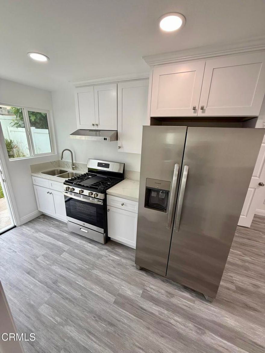 Unique chance to rent a beautiful Newly remodeled permitted ADU in desired Driftwood Swim and Racquet Club community. The converted ADU is new construction (2025) is fully permitted with AC unit, beautiful new luxury vinyl flooring throughout, white kitchen cabinets with new stainless steel appliances. The ADU features two bedrooms and one full bath, stackable washer and dryer inside the unit, living and dining area two or more parking spaces inside the gated driveway, recessed lighting throughout, and new double pane windows. Utilities are included in the lease! Access to amenities is included: gated key entry Tennis courts and heated pool/spa and big clubhouse. Clubhouse is available to host gatherings and has lots of tables and chairs. Picnic tables are available by the pool area.  The entry to the gated amenities is keyed and for residents only. ADU is conveniently located right across the amenities and by walking distance to Seabridge Marina shopping and restaurants plaza. Hollywood beach is only 2.1 miles away. No pets are allowed.