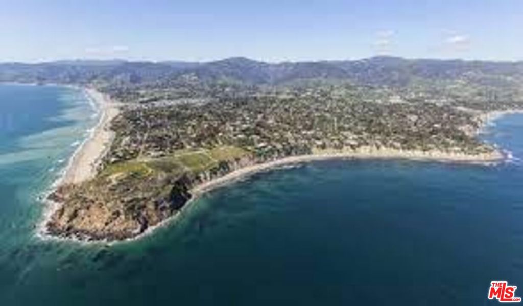 First time on the market in over 53 years, this original Pt. Dume home offers 1.2 acres of verdant grounds on a coveted street that commands some of Malibu's highest estate prices. Ideally located just a short 400 feet from the new stairs to Big Dume Beach and the Pt Dume Headlands Natural Reserve. Cliffside Drive is home to music legends, surf icons, royalty and long-time Malibu residents fortunate enough to have spent a lifetime in this magical neighborhood. This single-level ranch-style home is filled with charm and a classic floorplan. The large two-sided brick fireplace warms both the living and dining areas. A retro kitchen with breakfast area opens to the breezeway/art studio. The bedroom wing shares a full bath area with spa tub, shower and original tile. A large brick patio and yard for entertaining overlooks the additional parking area and showcases the ocean view. Mature landscaping graces both the entry yard and rear grounds. This remarkable opportunity for a highly desirable Cliffside Drive address and premier location rarely comes along at this price.