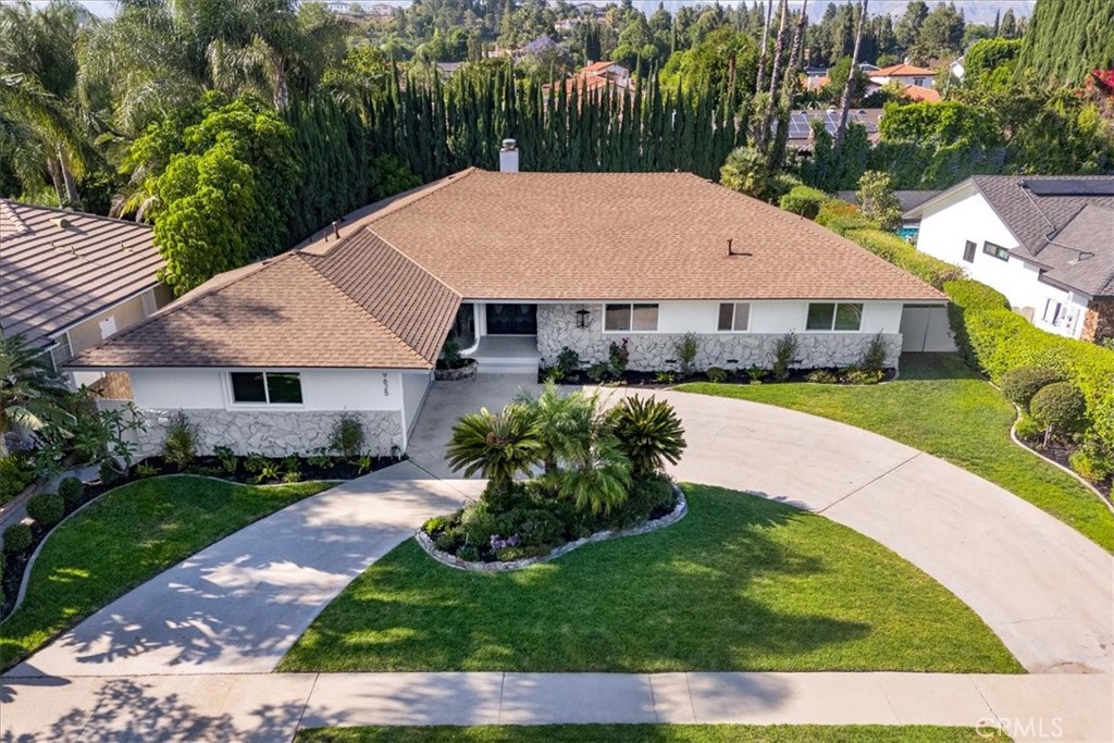 Remodeled to perfection and nestled in the highly sought-after Devonshire Country Estates adjacent neighborhood. This expansive 2,600 sq. ft. residence sits on a beautifully landscaped 11,000 sq. ft. lot, offering a perfect blend of elegance and comfort. Showroom quality, with the finest of materials. This home is completely remodeled, brand new roof, A/C, dual paned windows, flooring, kitchen, bathrooms and Pool. The home boasts a spacious, Chisholm built well-designed floor plan featuring 4 bedrooms, 2.5 baths, two fireplaces, a formal dining room with exquisite curved glass windows that add a touch of timeless charm, overlooking the open concept family room with wet bar and stunning fireplace overlooking the private rear yard. Both the family room and living room offer abundant natural light, with large windows and sliding glass doors leading to a sparkling pool and a large covered patio—ideal for indoor-outdoor living and entertaining. This back yard is the perfect mix of hardscape, landscape and pool/spa area, what a great entertaining yard!
The primary suite is a true retreat, with access to the rear yard. The primary bathroom is exquisite, you step into luxury and comfort. Free standing soaking tub, separate shower, magficiencent style and comfor Three additional bedrooms, all generous in size with closets that offer storage galore! The meticulously landscaped backyard offers privacy and tranquility, complete with a sparkling swimming pool and spa, perfect for relaxation or hosting guests. The oversized patio cover provides lots of shade in the summer and protection.
This home also features a concrete circular driveway and a two-car attached garage, providing ample parking and easy access, small RV access too. The location in the prestigious Devonshire Country Estates adjacent places you in one of Northridge’s most coveted neighborhoods, blending privacy, convenience, and community .Surrounded by beautiful homes and a cul de sac too
Don’t miss the opportunity to own this exceptional property!