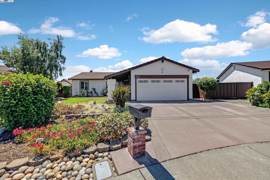 Open House Sat & Sun 1 to 4. Original Owners have Loved this home and it shows! Pride of Ownership Inside and Out. Too many upgrades to list them all. Great Curb Appeal and Beautifully Landscaped. Custom Driveway, Entry Walkway and Porch. Step inside too Tile flooring in entry, kitchen, hallway and bath rooms. New Laminate in Living Room and Family Room. Floor to Ceiling Brick Fireplace. Amazing Kitchen with Custom Cherrywood Cabinets, Granite Counter Tops, Black Stainless Steel Refrigerator, Dishwasher and Microwave. Electric Cooktop and Stainless Steel Oven. Island Breakfast Bar with Stools. Dual Pane Windows, Crown Molding, New Lennox Furnace and Air Conditioning. Both Bathrooms Updated and Sparkle From Top to Bottom. Bedrooms with Ceiling Fans, Mirrored Closet Doors, Carpets and Crown Molding. One Bedroom with Custom Built Shelves and Drawers. Also a Custom Built Storage Bed and Night Stand, can stay if you wish. Two car garage with Built in Cabinets, Workbench, Laundry Area, Sink, Washer, Dryer, Trash Compactor and Refrigerator all stay with home. Spacious Low Maintenance Backyard. More awaits your discovery.