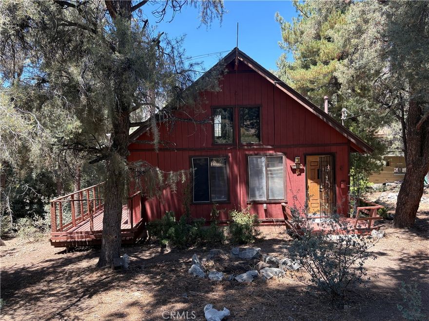 Mountain cabin located in a private setting tucked back from the street surrounded by numerous pine trees & natural rocks. Home was built by a Swedish contractor and his son. A-frame design featuring vaulted tongue & groove ceilings, living room that opens onto a side deck, kitchen w/stone counters, breakfast bar w/ newer oven/range & refrigerator. 2 good sized bedrooms on main entry level. One full bath features a medicinal quality whirlpool tub &  shower as well as another 1/2 guest bath w/washer/dryer hook up. **PLUS a Huge loft above (not included in stated sq. Footage) that is a perfect multi-use space featuring a large window w/mountain & forest views. Newer flooring-laminate in bedrooms, kitchen & bathrooms, carpet in loft & living room. 

Small workshop underneath house. Tons of parking & yard space all around. All this!and you can walk to the Pine Mountain Club Village Center & nearby Clubhouse amenities that include an outdoor swimming pool, tennis, golf, equestrian, shops & restaurants. 

This home & private setting is one you don’t want to miss!
