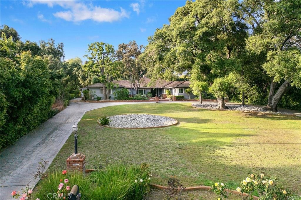 Located on one of the most desirable Feng Shui treasure lands in the prestigious Upper Rancho area of Arcadia, this property sits on an expansive, flat lot approximately 140 feet by 300 feet, gently elevated step by step from the street. Facing south, the lot is surrounded by mature trees on the east, north, and west sides, offering natural beauty, privacy, and symbolic protection of fortune and prosperity. The home features a well-designed floor plan with 5 bedrooms and 5 bathrooms, including 3 en-suite bedrooms. The spacious and open layout offers excellent potential for remodeling or rebuilding your dream estate. This is a must see in area.