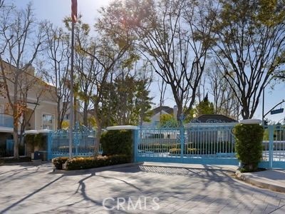 This is a wonderful condominium in the private, and gated community of Newport Ridge Vistas. This property has a large Living Room with a fireplace and very high ceilings. There are sliding doors that open to a wonderful patio. You walk up some stairs to the Dining room overlooking the Living Room, Family Room and Kitchen that has nice travertine floor. The Kitchen also has granite counters including a center Island with the gas stove top. There is a separate laundry room with a storage area. Downstairs is a very spacious two car garage with storage. On the third level there is the main Bedroom with two huge walking closets, sliding doors to the balcony, fireplace and an adjoining bath with tub and separate shower, including a his and hers vanities. There is separate guest room, hall bath and a large loft that could be the third bedroom or an office. The association amenities include a pool, spa and a small park. It is close to Fashion Island, Newport Coast shopping plaza, community parks, the freeways and the beautiful ocean.