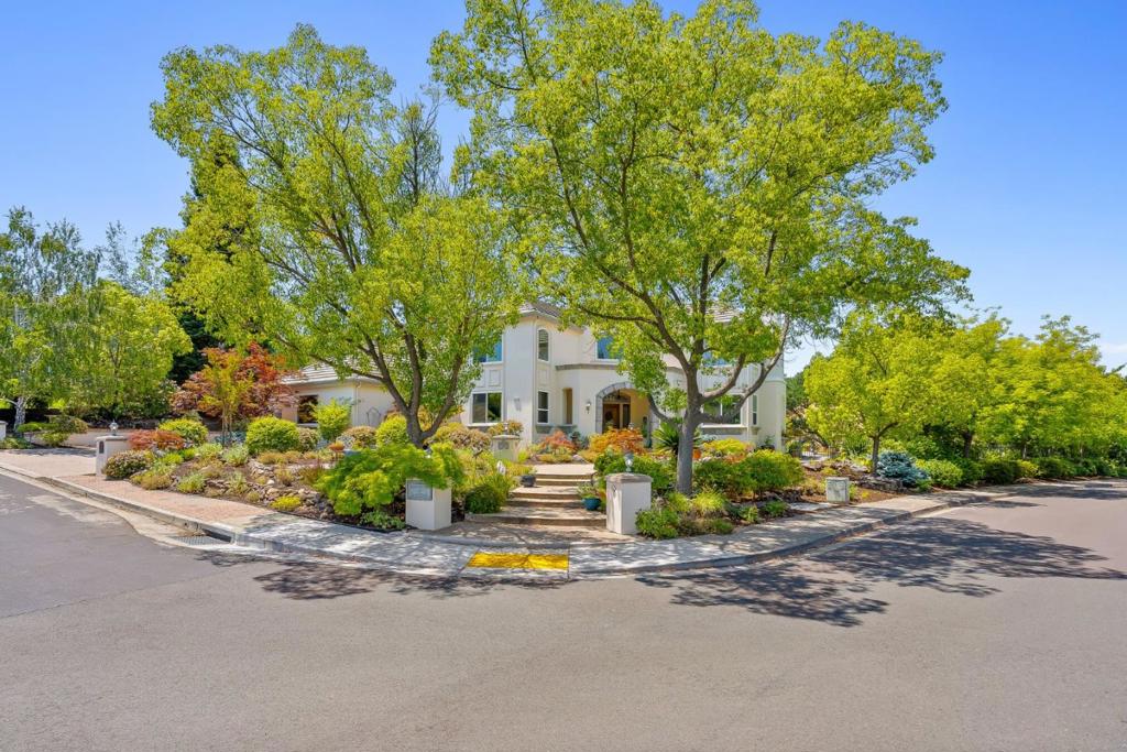 EXCEPTIONALLY MAINTAINED | MOVE-IN READY | KOTTINGER RANCH GEM Welcome to this stunning, custom-built home in the prestigious community of Kottinger Ranch. Perfectly positioned on a premium corner lot that backs up to a tranquil greenbelt, this property offers privacy and sweeping hillside views just one mile from Downtown Pleasanton and minutes from the 580/680 freeways. Discover a fantastic floorplan designed for luxury and function, with high ceilings, spacious rooms, and abundant natural light throughout. The circular foyer and sweeping staircase set the tone for the homes elegant design. A formal living room with fireplace and towering windows flows into the chefs kitchen featuring a copper gas stove, farmhouse sink, Sub-Zero refrigerator, dual dishwashers, and walk-in pantry. A thoughtfully placed en-suite bedroom sits on the main level, ideal for guests or multi-generational living. Upstairs, the expansive primary suite includes a private seating area and spa-like bathroom, while three bedrooms share a well-appointed bath. The home offers seamless indoor-outdoor living with a landscaped yard, outdoor kitchen with pizza oven, and bocce ball court. Kottinger Ranch residents enjoy access to a clubhouse, swimming pool, tennis courts, playground, and scenic hiking trails.