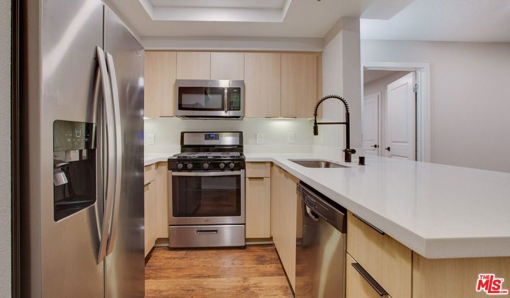 Welcome home to this 2 bedroom/ 2 bathroom luxury apartment in prime Beverly Grove! This apartment has quiet courtyard view. This Matinee Premier bright apartment features a fireplace, balcony, designer finishes, & in-home washer/dryer. The brand new kitchen boasts quartz counters, new soft-close cabinets, stainless steel appliances, built-in wine refrigerator, recessed can lighting, and a gas range. Enjoy the large pool with plenty of loungers, fire-pits, a barbecue lounge, and sauna. Your new home features smart home technology. Your new door is secured with high-grade locks including keyless entry and high-level encryption and smart thermostats. You'll also enjoy free delivery from Erewhon and a Smart Package 365 locker system. Electric vehicle chargers are on-site. A must see! Other units available - please inquire. Lease price is based on a 18 month lease length.