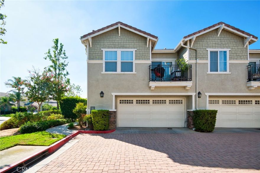 Discover the epitome of modern living in this exquisite corner unit within Rancho Cucamonga's prestigious Brighton at Etiwanda community. This thoughtfully upgraded 2-bedroom, 1-bath residence boasts an open-concept layout with soaring ceilings, where all living spaces are conveniently situated upstairs for enhanced privacy.  The contemporary kitchen stands out with its self-closing cabinets, premium quartz countertops, stainless steel appliances, and generous pantry—ideal for everyday meals or hosting gatherings. Adjacent, the dining area features a chic light fixture and seamlessly connects to the living room, bathed in natural light from expansive windows. Step out from the living space or the master bedroom onto one of two private balconies, perfect for morning coffee or evening unwinding.  The master suite offers a spacious walk-in closet, direct balcony access, and an en-suite bath with dual sinks, modern cabinetry, quartz vanity, and a walk-in shower. Throughout the home, durable wood-look waterproof luxury vinyl flooring adds a touch of elegance, complemented by a convenient indoor laundry area for full-sized appliances.  Additional highlights include a large attached 2-car garage with direct access and extra storage, plus recent remodels in the kitchen and bath. Community perks abound with low HOA dues covering water, along with access to a resort-style pool, spa, outdoor showers, BBQ and picnic areas, and a playground.  Ideally positioned just moments from Victoria Gardens for upscale shopping, dining, and entertainment, and with seamless connectivity to the 15, 210, and 10 freeways, this home delivers unparalleled convenience in a sought-after neighborhood. Schedule a viewing today and envision your future here.