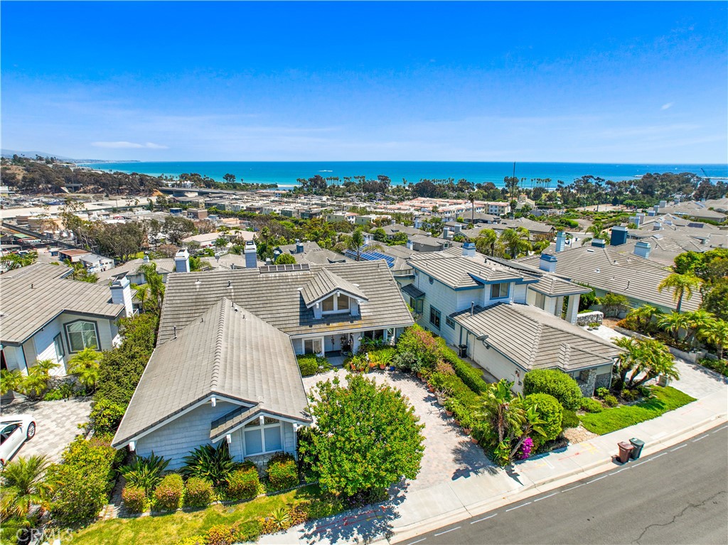 Welcome to coastal living at its finest! This beautifully appointed 4-bedroom, 3.5-bathroom home is nestled in the sought-after Village of Dana Point, offering sweeping panoramic views of the Pacific Ocean, coastline, and the whitewater waves of Doheny State Beach. Located just a quarter mile from Dana Point Harbor and Doheny State Beach, this home is the perfect blend of luxury, comfort, and convenience. The main level features the spacious master bedroom, a chef’s kitchen with high-end appliances, and a large open-concept living area that leads to an expansive balcony—ideal for relaxing, entertaining, or simply soaking in those breathtaking ocean sunsets. Downstairs, you’ll find two additional bedrooms, and two full bathrooms, a dedicated laundry room, and a charming backyard for quiet outdoor enjoyment. An additional private office space on the main level makes working from home a breeze. Additional features include: 3-car attached garage, Located in a well-maintained HOA community with a pool and lush landscaping (landscaping included in rent), Ample natural light and coastal breezes throughout, Minutes from shops, restaurants, beaches, and freeway access. Don’t miss your chance to lease this rare gem in Dana Point—schedule a private showing today!