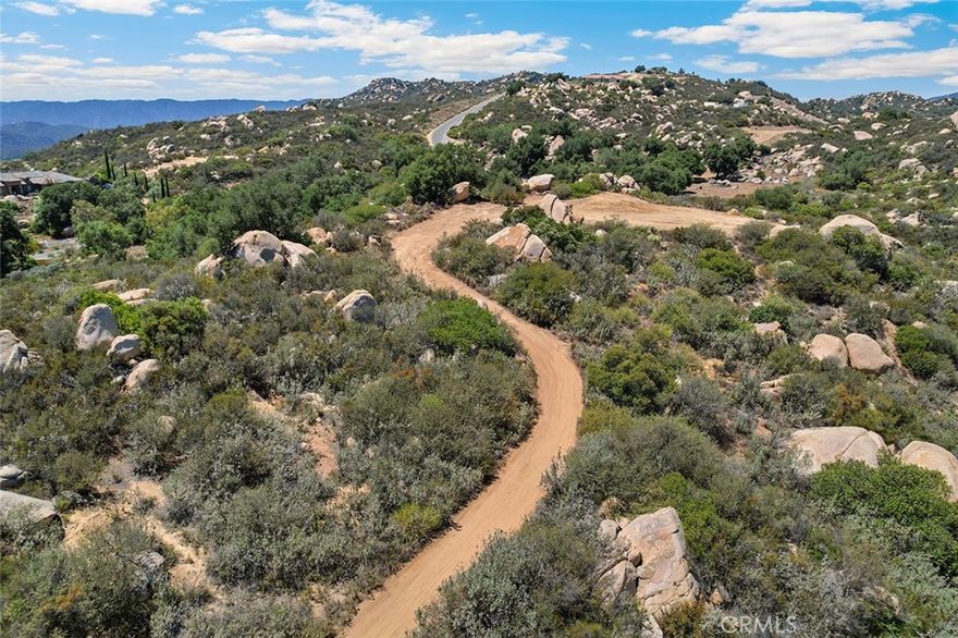 STUNNING 5-ACRE PARCEL WITH MASSIVE VIEWS OF THE LA CRESTA VALLEY & MAJESTIC LOCAL MOUNTAINS. If you are looking for a parcel to develop quickly, this one checks those boxes!  It has a WATER METER already installed, providing a huge discount toward building costs. Also available are the engineered GRADING PLANS and Architect-designed custom HOUSE PLANS. The parcel has been recently cleared to provide an easy drive and view from the potential building pad. It is located in highly desired Tenaja, a Community Service District (not an HOA), on the stunning Santa Rosa Plateau, home to multi-million-dollar estates and ranches. When you visit this site, you will be greeted by ancient oak trees, gigantic boulders and gentle terrain. With further clearing, you will have an abundance of usable land, upon which to build your dream estate. See this one today!  It’s easy to tour and well worth the visit! Get ready for the AWESOME VIEWS!  *****SANTA ROSA PLATEAU: 5-acre minimum parcels (10-acre minimum in SR West), just minutes to schools, restaurants, hospitals, grocery stores, 15 Fwy & Temecula Wine Country. Enjoy this peaceful ranch community w/no commercial businesses, robust social activities, miles of private community trails & 1000s of acres of Ecological Reserve…All less than 1.5 hours from LA, SD, OC, Palm Springs & Big Bear. Discover the country, yet convenient, lifestyle of La Cresta, Tenaja & the Communities of the Santa Rosa Plateau!