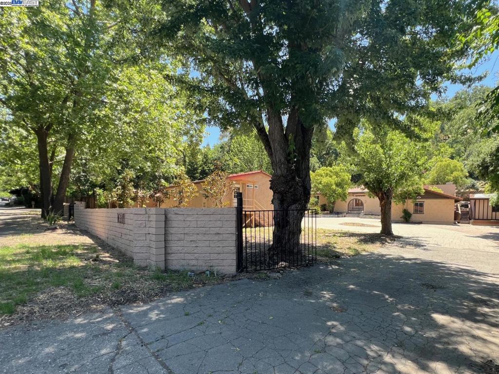 One story fixer on over an acre with detached three car garage. Two bedroom, two bath ADU plus separate workshop. Two-parcel lot split underway with County - two half acre lots. Fix up or build new. Up to six residential units after split. Excellent Alamo schools. Easy access to 680 and downtown Alamo.
