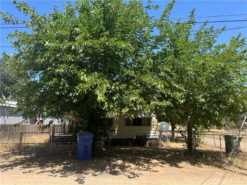 NEW price!! Own the land at this Fully fenced corner lot with mature shade trees and a covered deck with enclosed sun room. Large primary suite bedroom with lots of closet space. Main bathroom has a shower over tub and the home comes with a washer/dryer. Park one car in garage, and two more in the driveway with plenty of street parking for guests.
