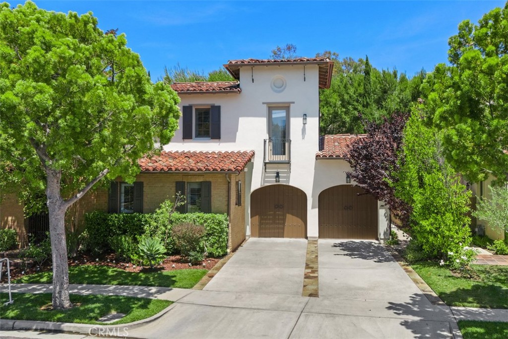 This stunning Mediterranean-style home, built in 2004, offers 4 bedrooms and 4.5 bathrooms across approximately 3,450 square feet of refined living space all nestled on a 6,500 square foot lot on a cul-de-sac street all graced by a dramatic 34 feet of back yard privacy hedge and mature Italian cypress trees. Inside, warm walnut floors, stone-tiled baths, an open chef’s kitchen with granite counters, stainless appliances, double ovens, and a six-burner cooktop, plus a downstairs bedroom suite, powder room, and laundry room with sink ensure both comfort and convenience. Outdoors, the private yard, faux grass, fire pit, built-in barbecue area, gazebo, and private atrium entry with fountain create a seamless indoor-outdoor lifestyle in front and back areas. Located in the guard-gated Turtle Ridge community, this property enjoys top-tier community amenities such as Olympic-size pool, hot tubs, cabanas, two clubhouses (one with theater), fitness center, playgrounds, BBQ areas, and miles of scenic trails in Bommer Canyon. Positioned just minutes from the 73 Toll Road, UCI, Fashion Island, and John Wayne Airport, it offers perfect fusion of prestige and accessibility. Top-rated Irvine Unified schools, Vista Verde K–8, Rancho San Joaquin Middle, and University High—serve the neighborhood, making it an ideal choice for families. In short, this turnkey sanctuary combines mature, low-maintenance landscaping, resort-style living, and top school access—plus that rare, towering hedge—for buyers seeking privacy, luxury, and lifestyle in one of Irvine’s most coveted communities.