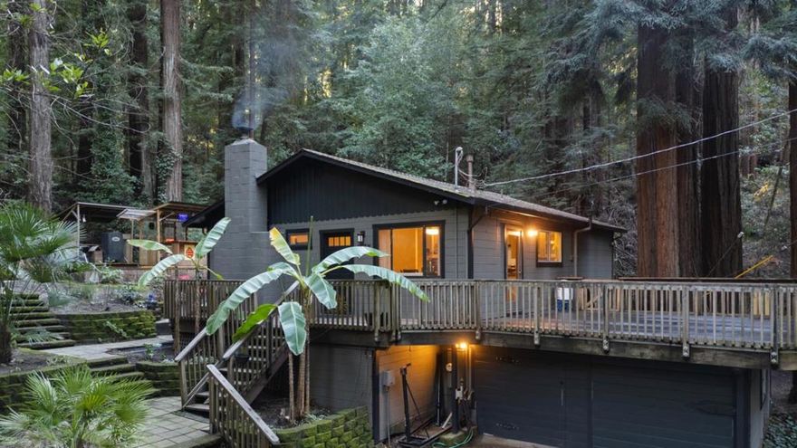 An entertainers paradise awaits in this charming home, featuring expansive backyard decking and a covered outdoor barperfect for crafting cocktails and hosting lively gatherings beneath the majestic Redwood trees. Winding pathways, tranquil seating nooks, and lush mature landscaping create a private retreat youll never want to leave. Inside, the thoughtfully designed floor plan offers a seamless flow between rooms, with expansive windows that flood the space with natural light and showcase the surrounding greenery. Vaulted ceilings enhance the spacious feel, while a cozy fireplace provides the perfect spot to unwind on chilly evenings. The recently renovated kitchen and dining area extend to an additional deck, ideal for relaxing under the stars. Located just minutes from downtown Feltons inviting restaurants like The Grove, scenic trails at Henry Cowell State Park, and the stunning beaches of Santa Cruzthis home blends tranquility with convenience.