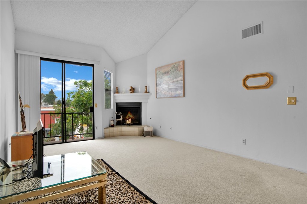 Welcome home to your spacious primary one-bedroom and one-bathroom condo with an additional sink in the vanity area in the heart of Tarzana, where comfort meets convenience. The unit has cathedral ceilings, a balcony with views of hills, a fireplace, and a step-down living room. Discover the community amenities, including an HOA included pool, two dedicated parking spots, and an upgraded intercom system called Butterfly MX. This smart system provides a complete property access solution through your phone. This prime location, located between Encino and Woodland Hills, is situated just across the street from a Starbucks and a park. Ventura Blvd, renowned for its shops, restaurants, and entertainment options, is just minutes away. Grocery shopping is a breeze with Trader Joe's, Gelson's, Vons, and Ralphs. The Westfield Topanga Mall and the new Rams Village are nearby, ensuring you have everything at your fingertips. Commuters can easily access the 101 and 405 freeways, the Orange Line and Red Line Metro, taking you throughout the San Fernando Valley, Universal City, Downtown LA, and Union Station. Don't miss this opportunity and schedule your private showing today!