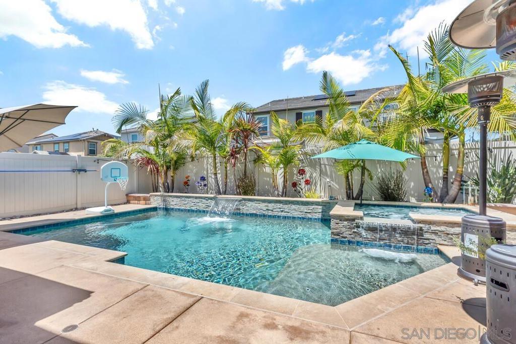 Welcome to this stunning 4-bedroom, 4-bathroom home offering 2,850 sq ft of thoughtfully designed living space, perfectly blending luxury, functionality, and energy efficiency. Situated on a beautifully landscaped lot, this home is packed with high-end upgrades and must-have amenities. Starting with 28 paid solar panels and custom built-ins. Step inside to find a chef’s kitchen featuring sleek finishes, an oversized walk-in pantry, and premium appliances—ideal for everyday living and entertaining. All bathrooms are fully upgraded with custom cabinetry and designer fixtures, while custom built-ins throughout the home provide added style and convenience. The spacious loft offers a versatile space for a media room, office, or play area. The luxurious primary suite includes a large bedroom, spa-like ensuite, and an upgraded walk-in closet. Outside, enjoy your own private paradise with a sparkling pool and spa, a BBQ area, and lush landscaping in both the front and back yards. Whether you’re hosting guests or enjoying a quiet evening, this backyard delivers the ultimate outdoor living experience. Additional highlights include: Paid solar with 28 panels for energy efficiency Whole house fan for added comfort EverLight system for permanent, customizable exterior lighting Custom built-ins for organization and style Fully finished garage with garage screen This home truly has it all—modern upgrades, curb appeal, and energy-smart features. Move-in ready and meticulously maintained, it's the perfect place to call home. Welcome to this stunning 4-bedroom, 4-bathroom home offering 2,850 sq ft of thoughtfully designed living space, perfectly blending luxury, functionality, and energy efficiency. Situated on a beautifully landscaped lot, this home is packed with high-end upgrades and must-have amenities. Step inside to find a chef’s kitchen featuring sleek finishes, an oversized walk-in pantry, and premium appliances—ideal for everyday living and entertaining. All bathrooms are fully upgraded with custom cabinetry and designer fixtures, while custom built-ins throughout the home provide added style and convenience. The spacious loft offers a versatile space for a media room, office, or play area. The luxurious primary suite includes a large bedroom, spa-like ensuite, and an upgraded walk-in closet. Outside, enjoy your own private paradise with a sparkling pool and spa, a BBQ area, and lush landscaping in both the front and back yards. Whether you’re hosting guests or enjoying a quiet evening, this backyard delivers the ultimate outdoor living experience. Additional highlights include: Paid solar with 28 panels for energy efficiency Whole house fan for added comfort EverLight system for permanent, customizable exterior lighting Custom built-ins for organization and style Fully finished garage with garage screen This home truly has it all—modern upgrades, curb appeal, and energy-smart features. Move-in ready and meticulously maintained, it's the perfect place to call home.