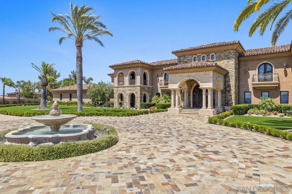 Luxurious Hilltop Estate in Poway’s Coveted Heritage Estates. Experience luxury on a grand scale in Poway’s premier gated community of The Heritage. This 15,323 sq ft smart estate is privately gated on 6.32 acres with 8 spacious bedrooms, 13 baths, panoramic 360° views, and high-end upgrades throughout. Features include freshly painted interiors, remodeled kitchen with top-trend finishes, newly updated primary suite with timeless design, spacious game room with bar, office, gym, and resort-style saltwater pool/spa. New turf in both front and back yards complement the low-maintenance landscape. Owned solar, Tesla battery system, and 2,500-gal irrigation well add lasting value. A rare blend of elegance, privacy and lifestyle. Beyond its own gated drive, the residence offers 8 bedrooms, 13 bathrooms, a fully owned solar system, and a 2,500-gallon irrigation well. Impressive amenities include a custom game room and bar, private gym, executive office/library, elevator, sport court, putting green, four oversized 2-car garages with ample built-in storage, and multiple indoor/outdoor living and gathering spaces. Recent upgrades include a Tesla home battery system, freshly painted interiors, a sophisticated kitchen updated with today’s top trends, and a reimagined primary suite enhanced with luxurious, classic details. At the heart of the property lies a resort-style saltwater pool and spa, framed by new turf and low-maintenance landscaping in both the front and back yards—ideal for enjoying Southern California living year-round. Whether you’re seeking a private luxury retreat or a premier investment, this exceptional estate offers a rare blend of scale, seclusion, and enduring value—set within the exclusive gated community of The Heritage Estates.