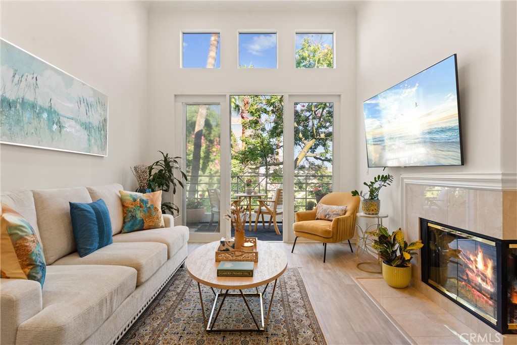 Discover Your Private Retreat in the Heart of Irvine!
Experience penthouse living at its best in the coveted Metropolitan community, where comfort, convenience, and serenity meet. This turn-key top-floor residence is ideal for travelers, professionals, or anyone ready to enjoy a low-maintenance, peaceful lifestyle. Despite being just minutes from John Wayne Airport, this home feels like a tranquil escape. Conveniently located near the entrance with two side-by-side parking spaces and just steps from the elevator, this house provides effortless accessibility.
Inside, soaring 13-foot ceiling and natural light create an airy, uplifting feel. The open living space features a cozy fireplace and dining area, while the versatile den with custom built-ins offers space for a home office, hobby room, or overnight guests.
Custom features include recessed lighting, quartz countertops, new flooring, additional decorative cabinetry for storage, and a drinking water filtration system. The primary suite is spacious, offering a walk-in closet, a well-appointed en-suite bathroom, and direct balcony access. Step onto your private balcony to enjoy calming treetop views—perfect for morning coffee or evening relaxation.
The Metropolitan offers resort-like amenities, including a 24-hour gated security, well-maintained lush grounds perfect for a relaxing stroll, a sparkling lap pool and large heated spa pool, well-equipped fitness center, and an elegant clubhouse. HOA dues include water, gas, and trash.
Schedule your private showing today and discover penthouse living designed for your next chapter!