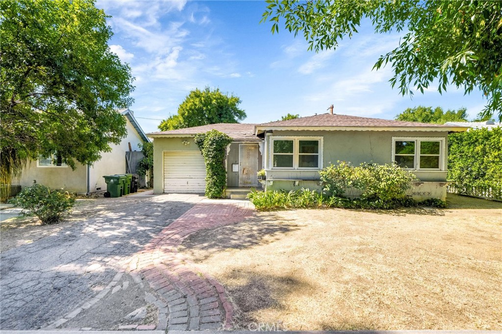 What an opportunity for someone with imagination and ideas! This adorable home has original wood floors, beautiful picture windows to the backyard, an open floor plan, some newer windows, a dreamy yard and enormous charm! Located beautifully on lovely Keswick Street, and across from a cul de sac this house is ready to be a home again. The home has a large eat-in kitchen, open living room and dining room as well as two nice sized bedrooms, both with replaced windows, a bath with some great original tile work as well as a tankless water heater, garage, and laundry room. The backyard is large and flat, with plenty of room for a gorgeous garden, or maybe an ADU! This home is perfectly priced for a buyer who is ready to put some love and work into it or an investor who is looking for an opportunity. Don't miss this sweet house.