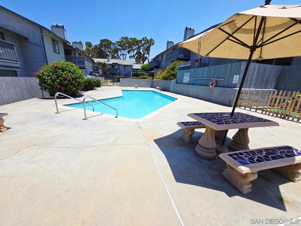 Seller will pay your HOA fees for the rest of 2025 on this rare Chula Vista condo with a private yard and a detached garage! This ground-floor 2BR/2BA corner unit lives like a private home and includes AC, in-unit laundry, and community pool access. Enjoy an unbeatable location with a short walk to all Hilltop schools and easy I-805 freeway access. Future value is bolstered by the nearby $1B+ Gaylord Pacific Bayfront development, cementing this as a smart investment. With the seller providing a massive financial incentive, this unique opportunity won't last. Schedule your tour today! Discover the rare home that truly offers it all—a private sanctuary where your life finds its perfect, effortless balance. This is your opportunity to own a piece of Chula Vista that masterfully combines the ease of community living with the coveted space and privacy you crave. Imagine a lifestyle where every convenience is at your fingertips, from a sprawling private yard and modern comforts to world-class amenities and an unbeatable location that simplifies your daily rhythm. Step inside your air-conditioned haven, a beautifully designed 2-bedroom, 2-bathroom layout that immediately feels like home. The stresses of the day melt away knowing that comfort is guaranteed, while the ultimate convenience of an in-unit washer and dryer and a private detached garage streamlines your routine. The true heart of this home, however, lies just beyond the sliding glass door. Your living space extends to an exceptionally large and private outdoor oasis, a feature rarely found in condo living. Picture your mornings with coffee on the spacious wood deck, evenings entertaining friends on the separate cement patio, and your furry companions playing freely in the surrounding green area, complete with its own charming fruit tree. This is the essence of Southern California living—a seamless indoor-outdoor lifestyle that is an unexpected and cherished luxury. This home’s location is a masterclass in convenience. The daily rush is replaced by peace of mind, built on a unique directional design. In one direction, a safe and easy stroll takes your children to any of the three highly-regarded Hilltop schools—Elementary, Middle, or High School. Turn the other way, and your own commute becomes a stress-free breeze with the 805 freeway just two blocks from your doorstep, connecting you effortlessly to Downtown San Diego, military bases, and the entire region. This unparalleled access saves you precious time every single day, giving you more moments to enjoy the things that matter most. Embrace a lifestyle rich with leisure and excitement, starting with a refreshing dip in the sparkling community pool on a sun-drenched afternoon. For the golf enthusiast, the prestigious fairways of the San Diego Country Club are just down the street. Beyond your immediate neighborhood, you are perfectly positioned to experience the thrilling renaissance of Chula Vista. Explore the historic charm of Third Avenue, with its growing collection of craft breweries, unique boutiques, and a diverse culinary scene. Even more exciting, you are just minutes from the monumental Chula Vista Bayfront transformation—Southern California’s next premier waterfront destination. This world-class development is anchored by the spectacular new Gaylord Pacific Resort, a stunning billion-dollar investment that brings with it new public parks, walking trails, and future bayfront dining, establishing your new home at the epicenter of regional growth. This property represents a unique and fleeting opportunity to own a home that truly checks every box: your own private yard for play and relaxation, the modern comfort of air conditioning and a private garage, and an unbeatable location for both family and work. You truly can have it all—the space you need, the convenience you crave, and a prime stake in a city with an incredibly bright future. Don't let this vision of a richer, easier life slip away.