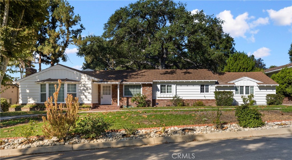 Located in Arcadia’s prestigious Highland Oaks neighborhood, this spacious single-story home offers comfort, charm, and a desirable floor plan. Featuring 4 bedrooms and 3 bathrooms across approximately 2,179 square feet, the residence provides generous living areas designed for everyday living and entertaining. The inviting living room centers around a classic fireplace, while the large kitchen with an adjacent dining area creates a natural gathering space. Hardwood floors are found in select areas, adding warmth and character throughout. The family room has been converted to a spacious fourth bedroom, offering flexibility for larger households or guests. A bright and airy sunroom extends the living space and opens to an expansive 14,867-square-foot lot, showcasing a sprawling grassy backyard ideal for outdoor activities, gardening, or simply relaxing. Additional highlights include a detached two-car garage and placement within the award-winning Arcadia School District. A rare lease opportunity in one of Arcadia’s most sought-after and peaceful neighborhoods.