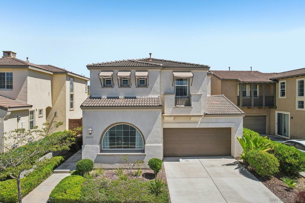 Nestled in the prestigious gated enclave of Torrey Highlands, 13517 Sydney Rae Pl, built in 2011, offers 3 bedrooms and 2.5 baths across approximately 2,234 sq ft of refined living space. Step inside to discover a welcoming foyer opening into formal living and dining rooms, anchored by beautiful wide wood-plank flooring—perfect for elegant gatherings. The heart of the home is the gourmet kitchen, featuring granite countertops, stainless steel appliances, a central island and a generous walk-in pantry—all designed for both culinary creativity and effortless entertaining. A versatile loft upstairs provides flexible living arrangements—ideal for a home office, media room, or second family lounge—adding modern convenience and functional space. Retreat to the spacious primary suite, complete with a large walk-in closet, custom built-ins, and plush carpeting, offering a serene haven to unwind. The laundry room is located upstairs for added convenience which includes two new LG washer and dryer. Outside, enjoy a private, low-maintenance backyard that backs to open space—ideal for weekend barbecues, al fresco relaxation, or simply enjoying the tranquility. Situated within Poway Unified’s top-tier elementary, middle, and high schools, close to parkland, shopping, and easy freeway access, this home is where move-in ready meets modern living.