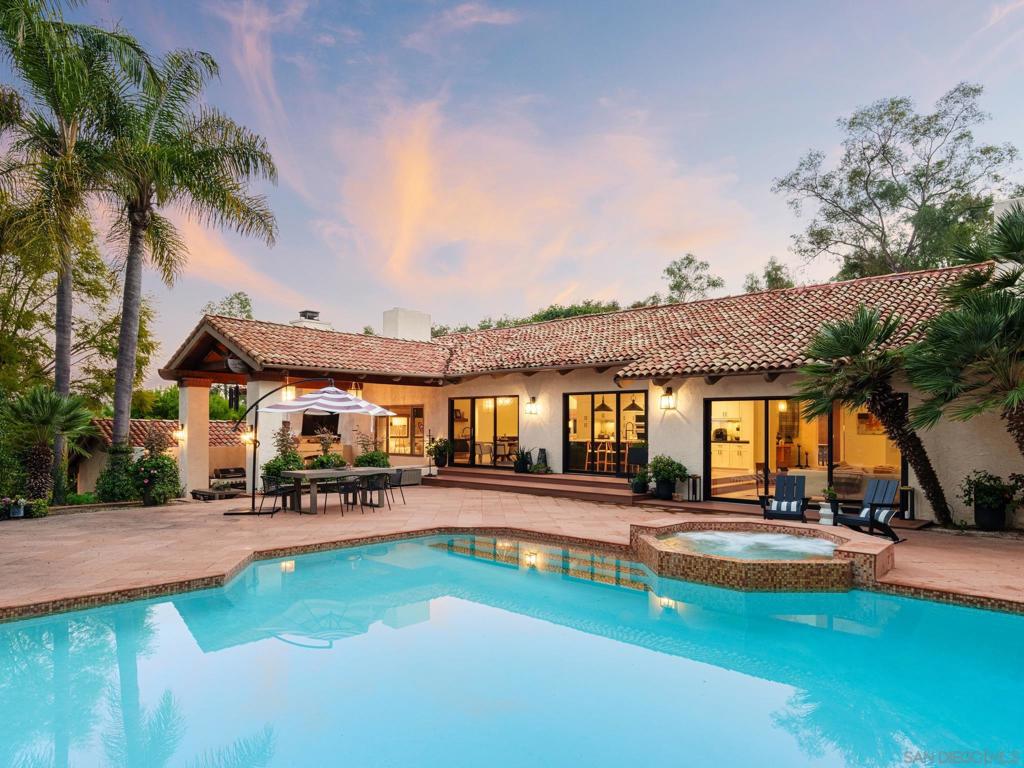 Welcome to 5340 Calzada del Bosque, a stylish refreshed 5 bedroom residence in the prestigious Rancho Santa Fe Covenant. This exquisite property has undergone a stunning transformation by a popular designer, resulting in a home that blends timeless elegance with a fresh and current aesthetic which is evident in every detail, from the carefully chosen color palette to the thoughtfully selected finishes. The spacious living areas boast an effortless flow, creating an ideal environment for both entertaining and everyday living. The gourmet kitchen is a chef's delight, equipped with high end appliances, custom cabinetry, and an oversized center island. Whether you're hosting a formal dinner party or enjoying a casual meal with loved ones, this kitchen is sure to be the heart of the home. Step outside to the expansive outdoor spaces, where manicured gardens, a private pool, and outdoor living areas invite you to enjoy the Southern California lifestyle year-round. A unique benefit this estate offers is a detached 3,285 SQFT building equipped with an oversized guest quarters with full bathroom, executive office, temperature-controlled wine room, dining room, and 12-car garage which doubles as the ultimate family fun center. Don't miss the chance to make this designer-refreshed masterpiece your own. and everyday living. The gourmet kitchen is a chef's delight, equipped with high end appliances, custom cabinetry, and an oversized center island. Whether you're hosting a formal dinner party or enjoying a casual meal with loved ones, this kitchen is sure to be the heart of the home. Step outside to the expansive outdoor spaces, where manicured gardens, a private pool, and outdoor living areas invite you to enjoy the Southern California lifestyle year-round. A unique benefit this estate offers is a detached 3,285 SQFT building equipped with an oversized guest quarters with full bathroom, executive office, temperature-controlled wine room, dining room, and 12-car garage which doubles as the ultimate family fun center. Don't miss the chance to make this designer-refreshed masterpiece your own.