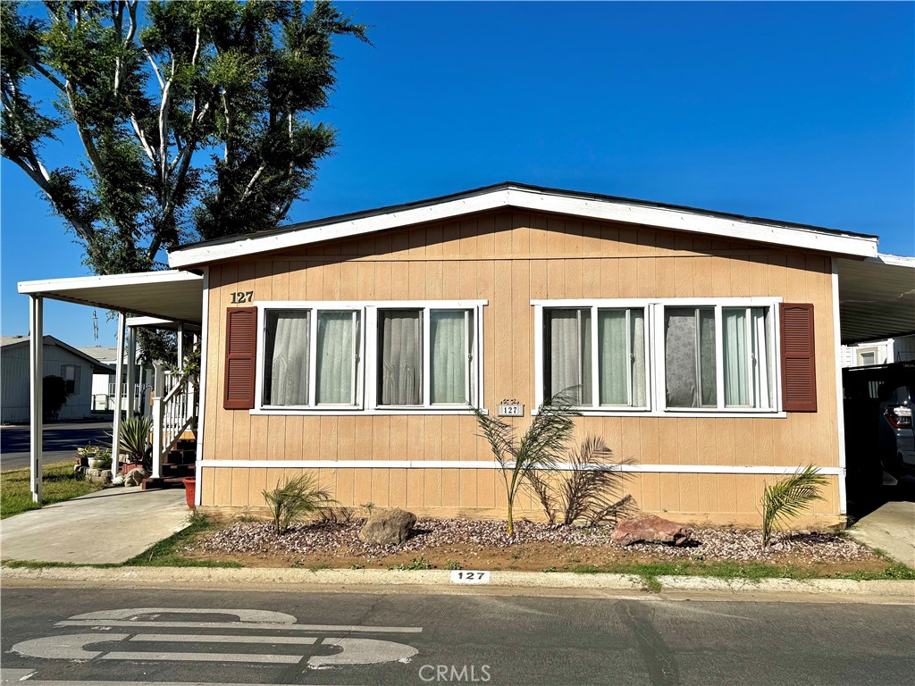 REMARKABLE OPPORTUNITY - CORNER UNIT WITH HUGE LOT! 3 Bedrooms | 2 Full Bathrooms | 1152 Sq Ft Home | All-Age Community with Swimming Pool and Basketball Court! RECENTLY UPGRADED Bathroom! You Will Love the Open Style Floor Plan - Kitchen, Dining, and Living Room Areas are large enough for you to get creative! Lots of Storage Space! Master Bedroom has Sliding Door that leads to Spacious Backyard! Laundry Area with Washer/Dryer Hookups! Enjoy the Convenience of both Front and Back Porches - Perfect for Relaxing! 3 Car Covered Carport Parking! Pets Welcome! Storage Shed Included! Easy access to lots of Shopping and Dining including: Downtown Corona and Tyler Mall, excellent public schools and Universities! Space Rent of $1500! Excellent location with close proximity to 15 and 91 Freeways!